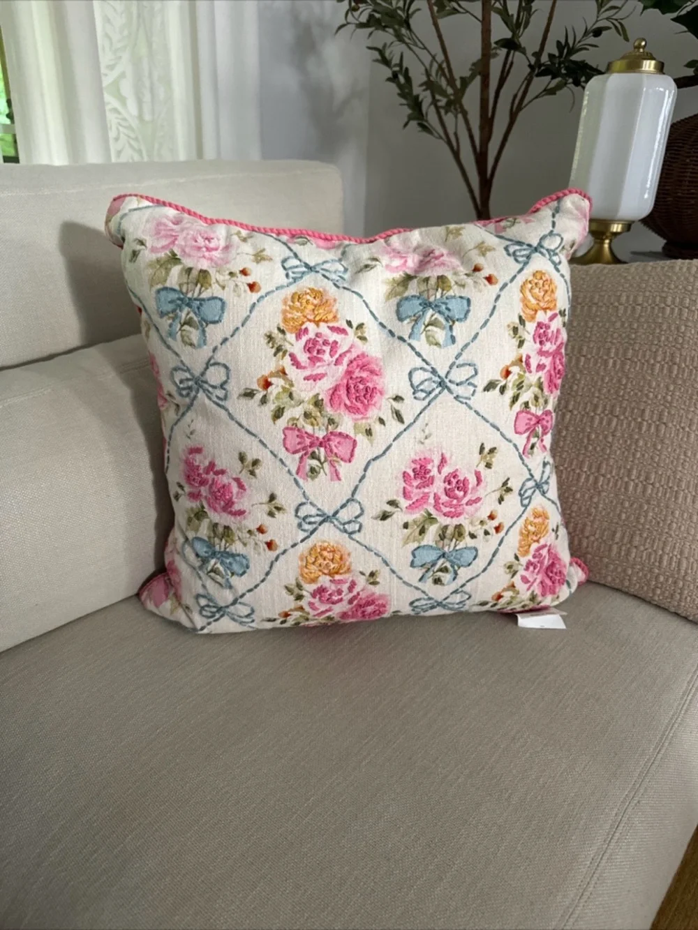 20” x 20” throw pillow features a trellis pattern with embroidered